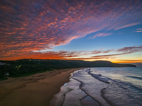 Winter dawn seascape over the beach with high and medium cloud c
