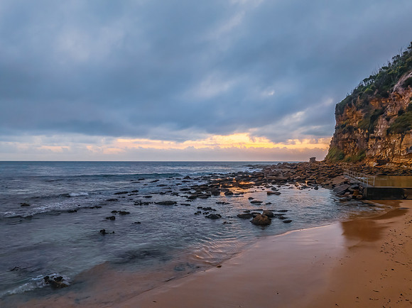 Cloud filled sunrise at the seaside