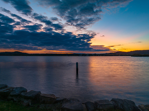 Sunrise over the bay with cloud cover moving in