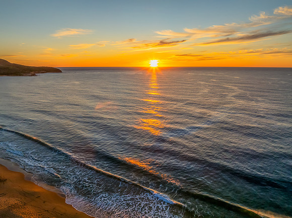 Sunrise at the seaside with high cloud