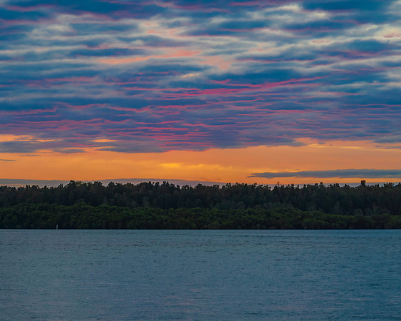 Sunrise over the bay with cloud cover moving in