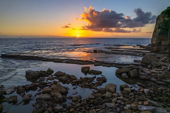 Aerial Sunrise Seascape at Rocky Inlet with clouds