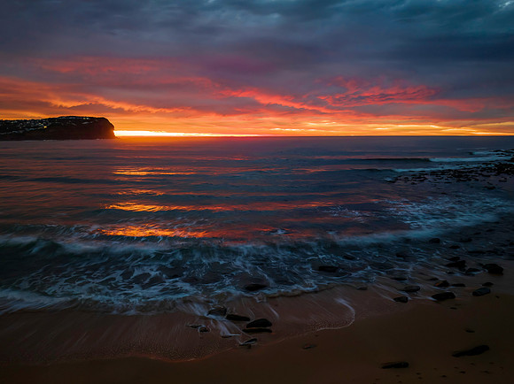 Cloud filled sunrise seascape