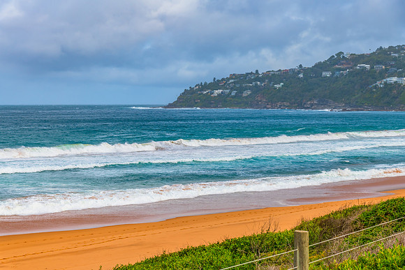 Scenic views at the seaside with waves and clouds in the sky
