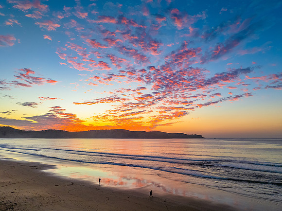 Sunrise seascape with pretty clouds in the sky
