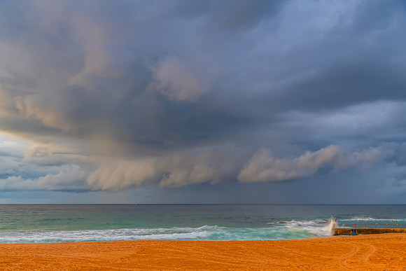 Sunrise at the Seaside with rain clouds
