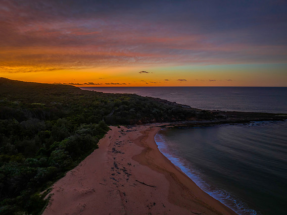 High cloud sunrise over the beach and mountain