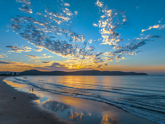 Sunrise seascape with pretty clouds in the sky