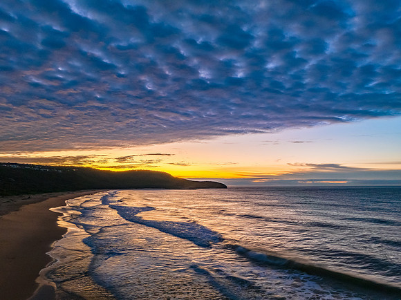 Winter seascape views over the beach with high and medium cloud