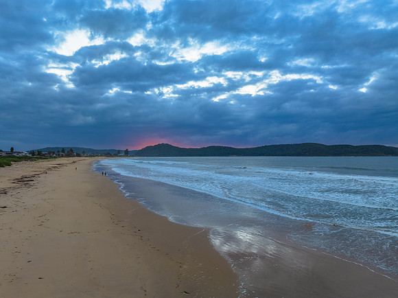 Sunrise seascape with low clouds