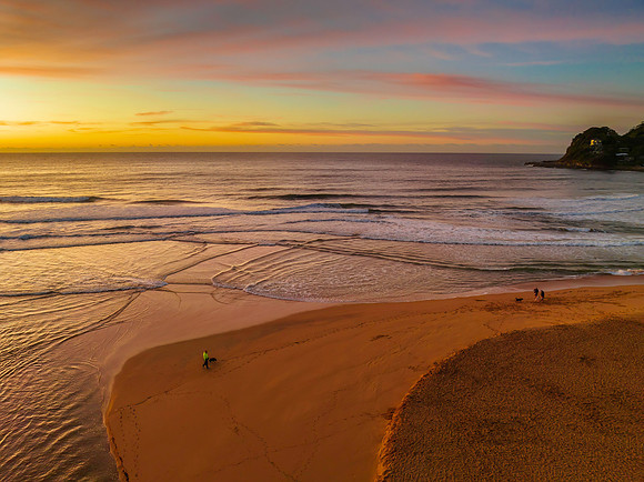 Sunrise and high cloud cover by the sea and lagoon
