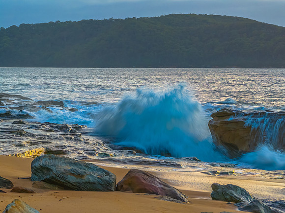 Sunrise, clouds and surf at the seaside