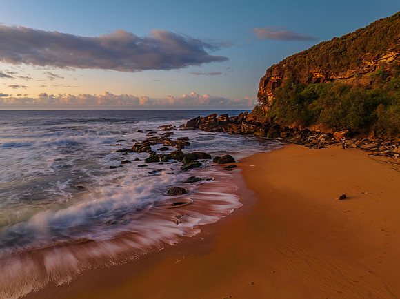 Aerial sunrise at the beach with clouds