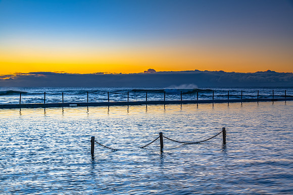 Sunrise by the sea pool