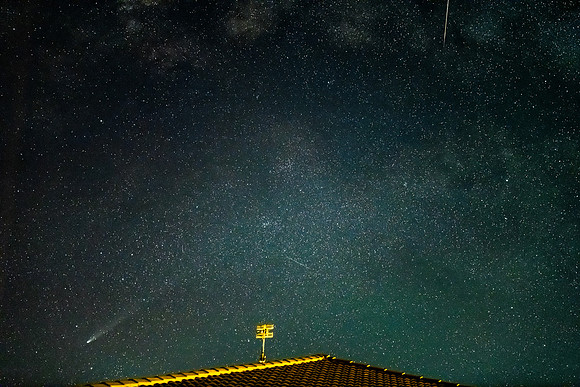 Busy night sky with comet, meteor and satellites amongst the sta