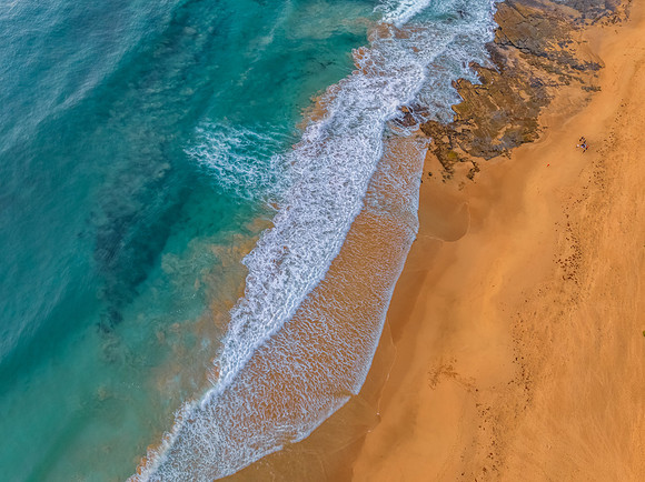 Aerial sunrise at the beach from above