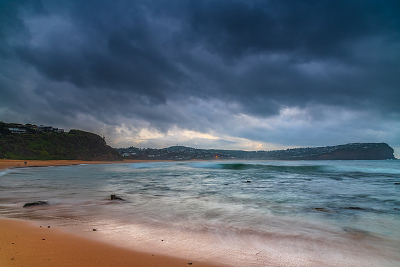 Cloud covered sunrise at the seaside