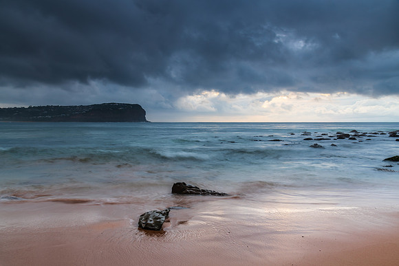 Cloud covered sunrise at the seaside