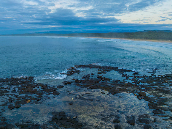 Sunrise with clouds and rocks