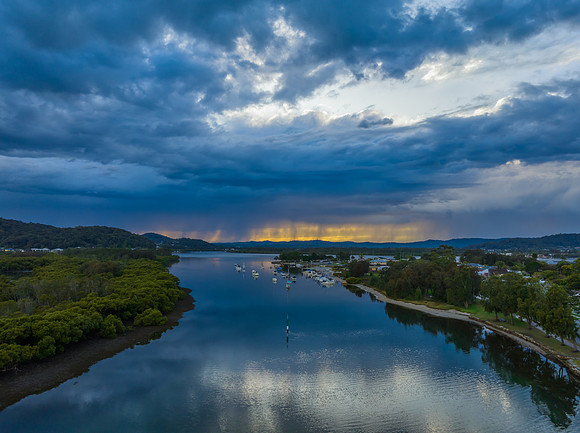 Early morning storm light and reflections at the waterfront