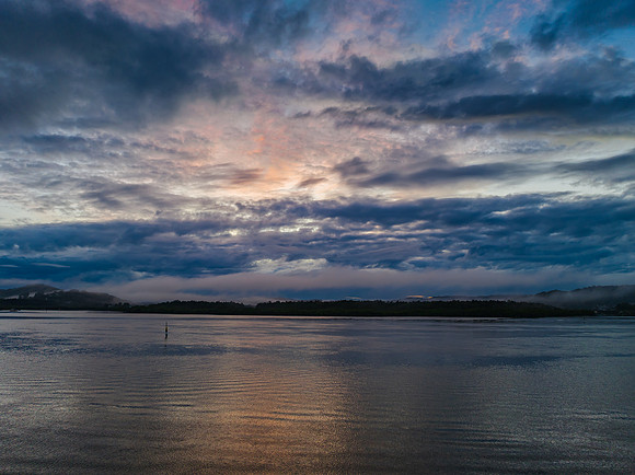 Respite from the rain - Bay waterscape with reflections