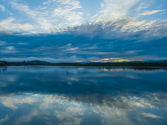 Respite from the rain - Bay waterscape with reflections