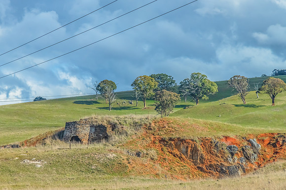 Country landscape with old historical lime kiln ruins
