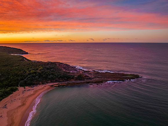 High cloud sunrise over the beach and mountain