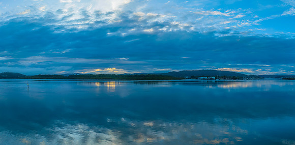 Respite from the rain - Bay waterscape with reflections