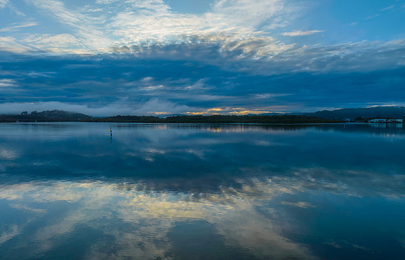 Respite from the rain - Bay waterscape with reflections