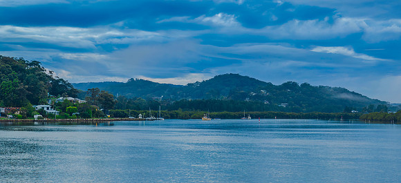 Respite from the rain - Bay waterscape with reflections