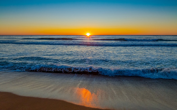 Sunrise at the seaside with a cloudless sky