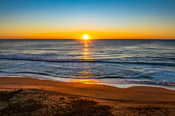 Sunrise at the seaside with a cloudless sky