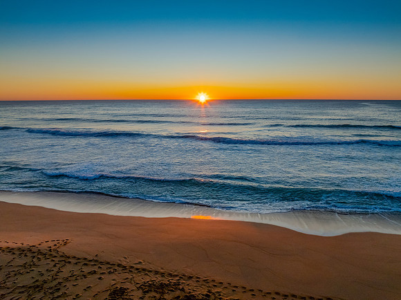 Sunrise at the seaside with a cloudless sky