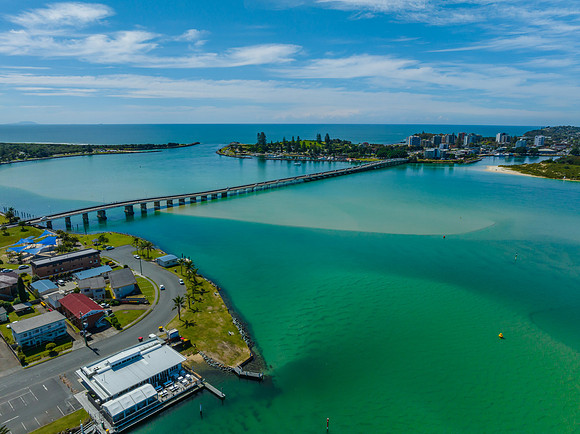 Bridge between two towns daytime waterscape