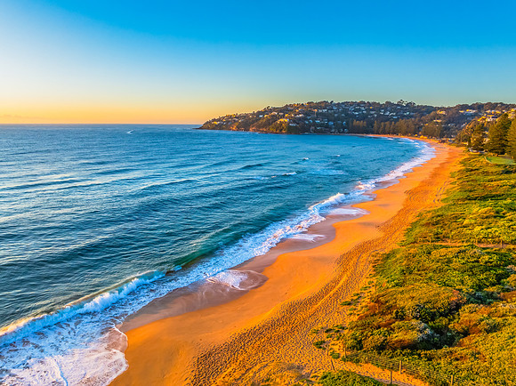 Sunrise at the Seaside with Clear Blue Skies