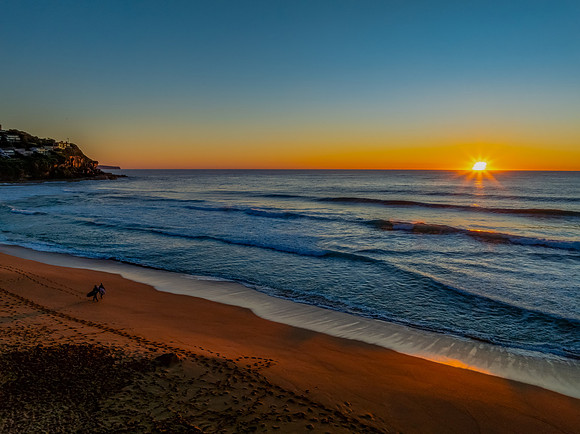 Sunrise at the seaside with a cloudless sky