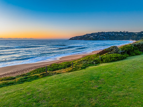 Sunrise at the Seaside with Clear Blue Skies