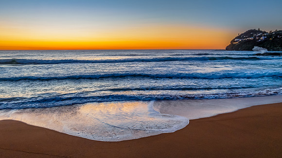 Sunrise at the seaside with a cloudless sky