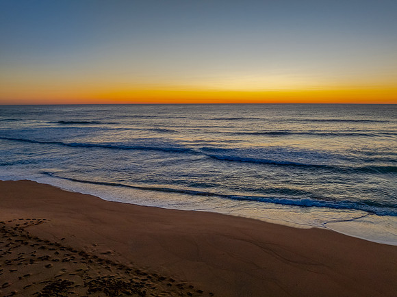 Sunrise at the seaside with a cloudless sky