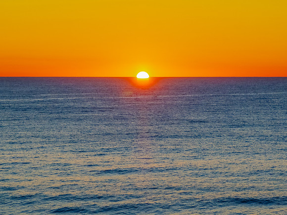 Sunrise at the seaside with a cloudless sky