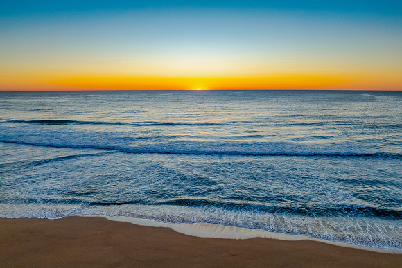Sunrise at the seaside with a cloudless sky