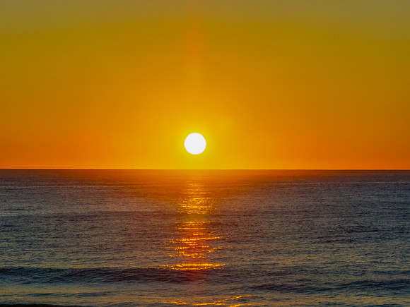 Sunrise at the seaside with a cloudless sky