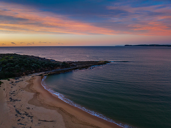 High cloud sunrise over the beach and mountain