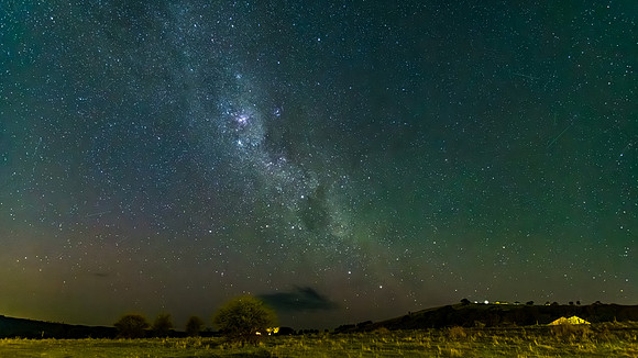 The Milky Way Night Sky with a hint of the Aurora over the count