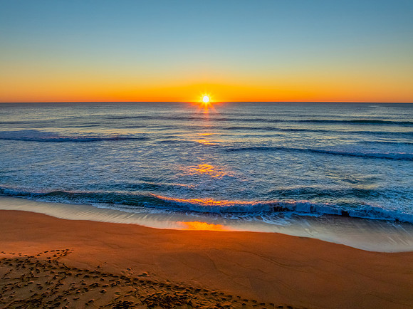 Sunrise at the seaside with a cloudless sky