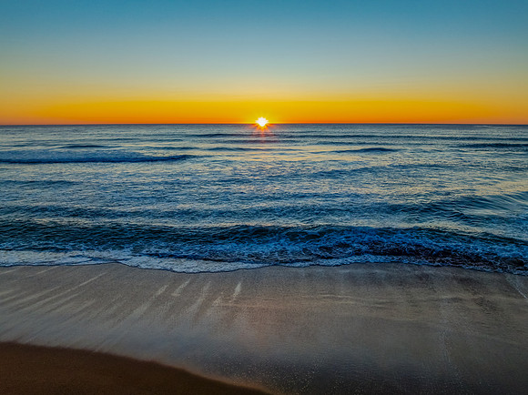 Sunrise at the seaside with a cloudless sky