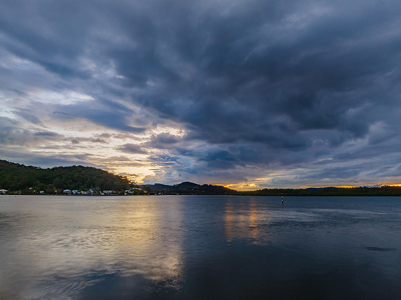 Stormy sunrise skies over the bay