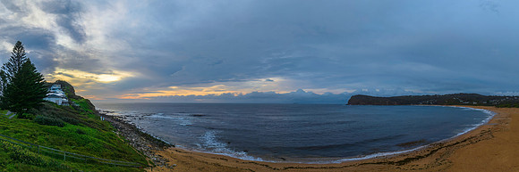 Pastel cloud covered panorama sunrise seascape