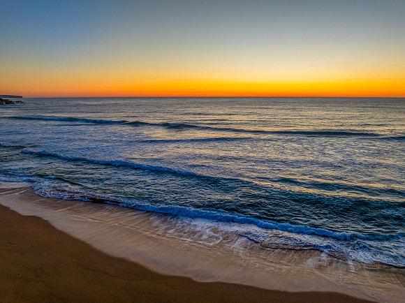 Sunrise at the seaside with a cloudless sky